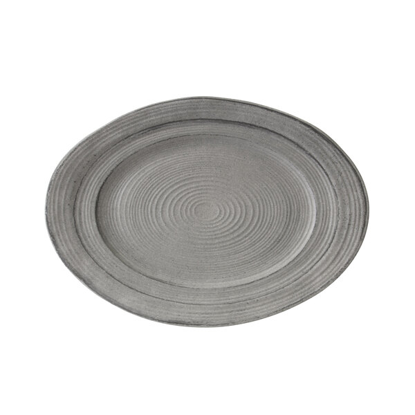 A gray melamine oval serving dish with a spiral pattern on it.