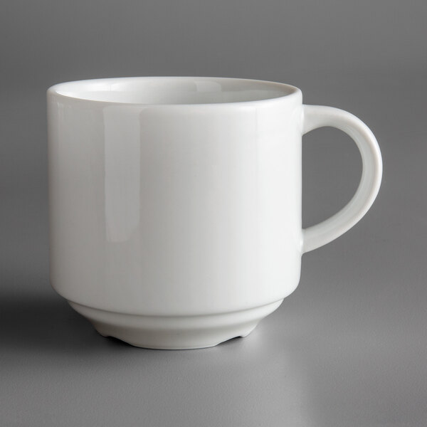 A stackable white porcelain cup with a handle.