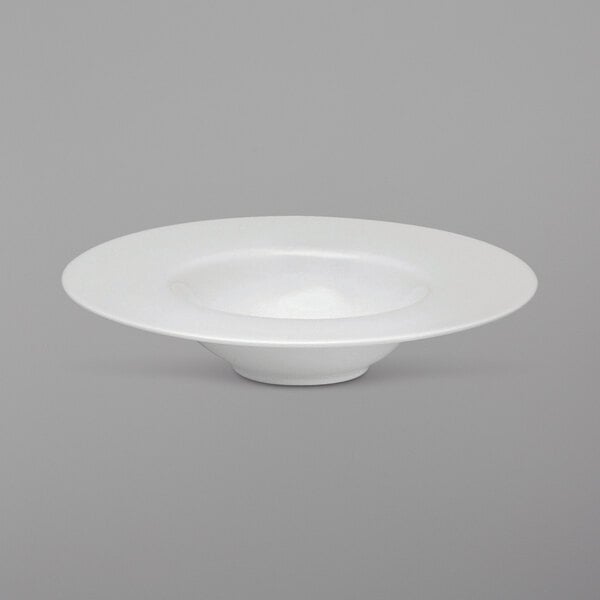 A Oneida Royale bright white porcelain top hat pasta bowl with a curved edge.