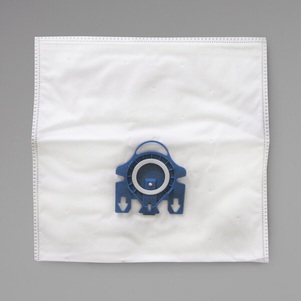 A white Miele vacuum bag with a blue and white circular object on it.