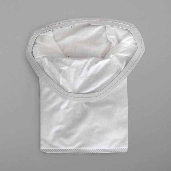 A close-up of a white fabric ProTeam vacuum bag with a white circle.