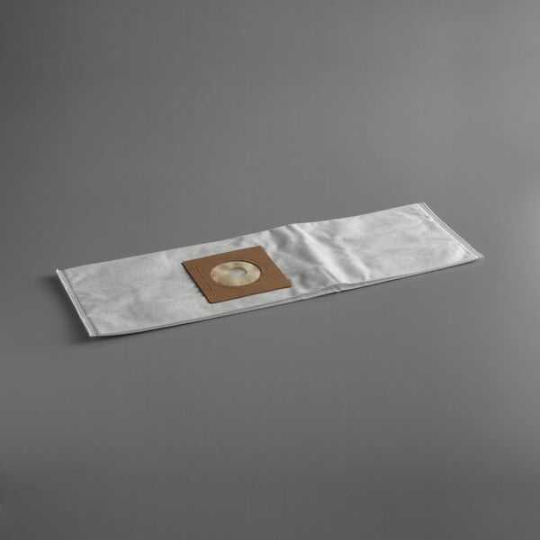 A brown rectangular Kirby Style 3 vacuum bag with a hole in the center.
