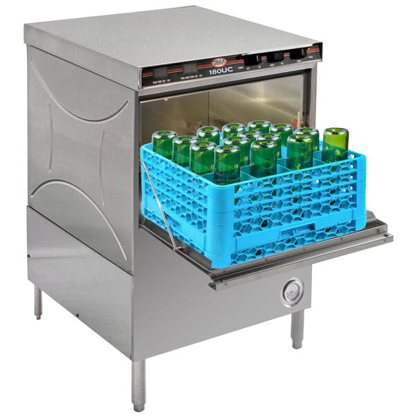 A CMA Dishmachines undercounter dishwasher with bottles in it.