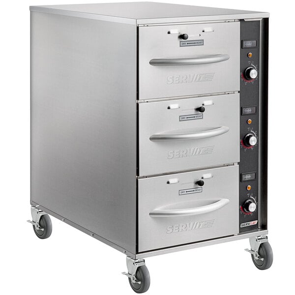 A stainless steel ServIt mobile drawer warmer on wheels.