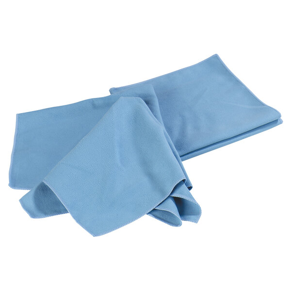 A pair of folded blue Carlisle microfiber cloths on a white background.
