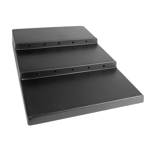 A black rectangular Delfin modular step riser with holes.