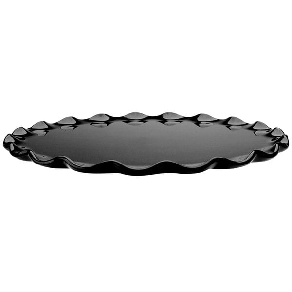 A black round melamine tray with a ruffle edge.