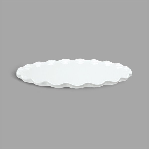 A white round melamine tray with a ruffle edge.