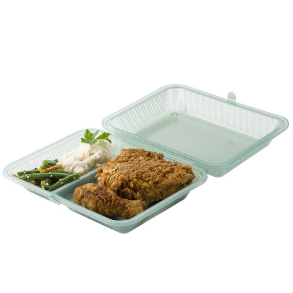 A jade green GET 2-compartment plastic container with fried chicken, rice and vegetables.