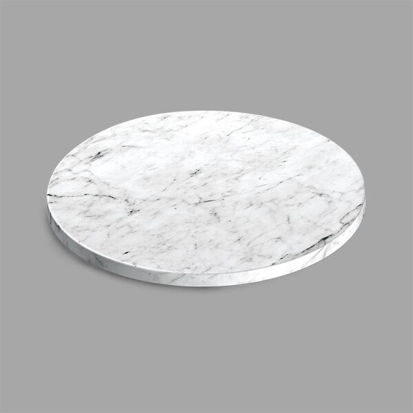 A white marble round serving board.