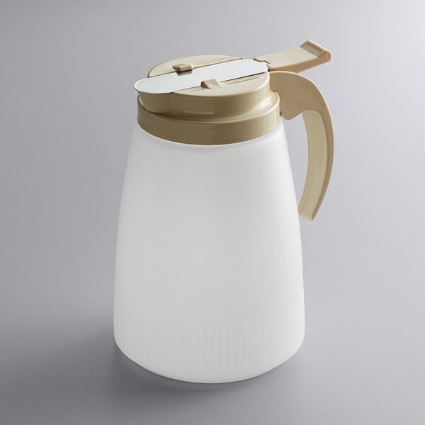 A white Vollrath polyethylene syrup server with an almond top.