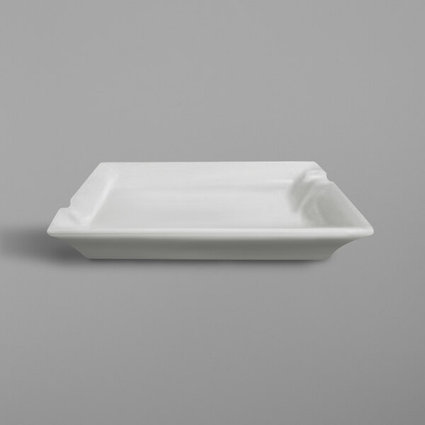 A white rectangular RAK Porcelain ashtray on a white surface.