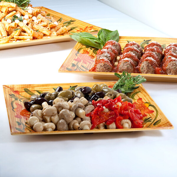 A table with a group of GET Venetian square plates of appetizers.