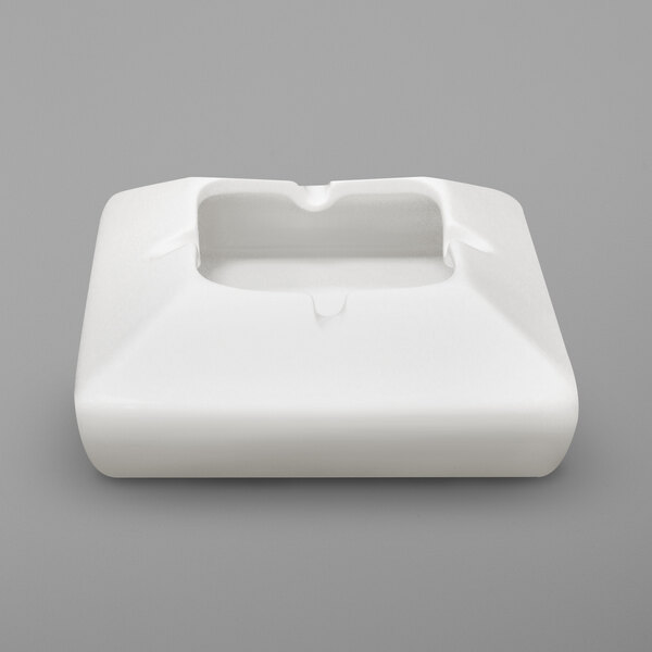 A white square RAK Porcelain ashtray with a hole in the center.