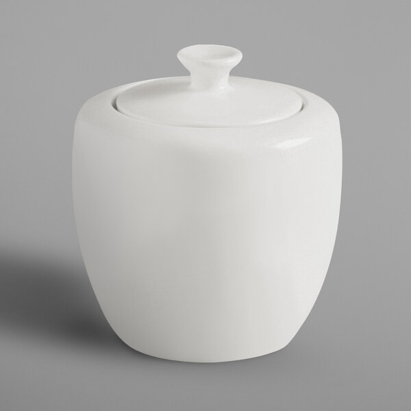 A white RAK Porcelain sugar bowl with a lid.