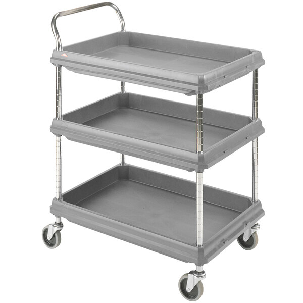A Metro gray plastic utility cart with three deep ledge shelves and wheels.