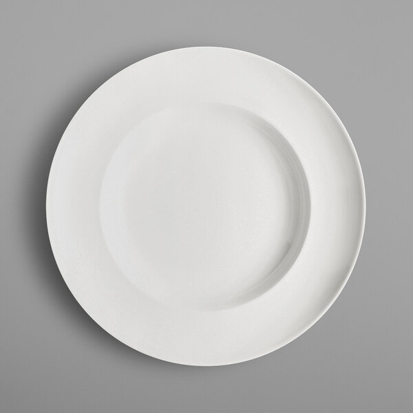 A close-up of a white RAK Porcelain deep plate.
