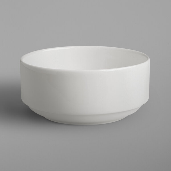A RAK Porcelain ivory china bowl on a gray background.