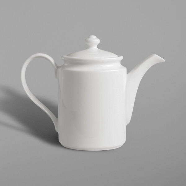 A close up of a RAK Porcelain ivory coffee pot with a white handle.
