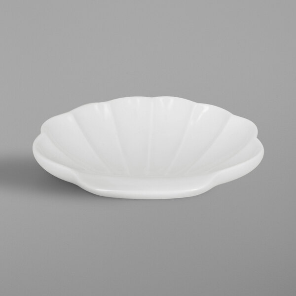 A white bowl with a shell pattern.