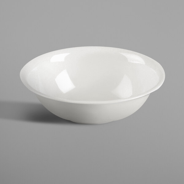 A white RAK Porcelain dish with a curved edge.