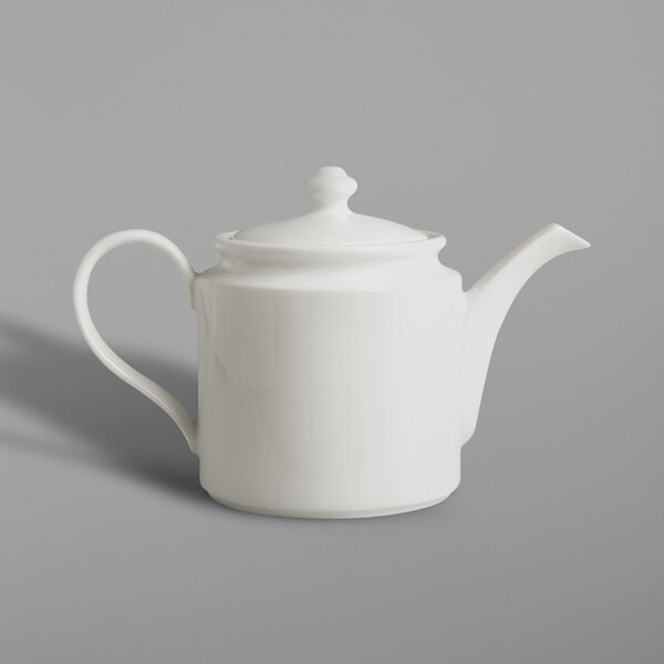 A close-up of a RAK Porcelain ivory teapot with a curved handle and lid.