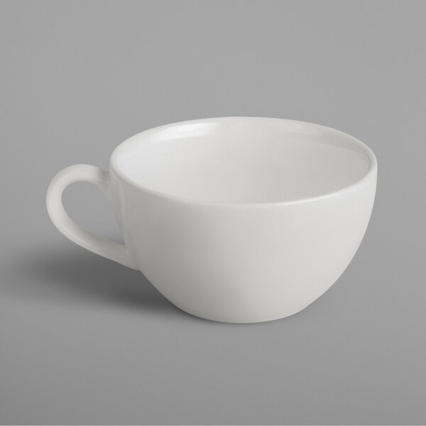 A white RAK Porcelain cup with a handle.