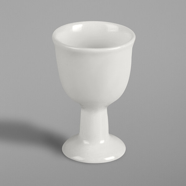 A close up of a RAK Porcelain ivory porcelain cup with a white rim.