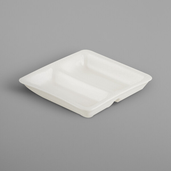 A white rectangular porcelain tray with two cubicles.