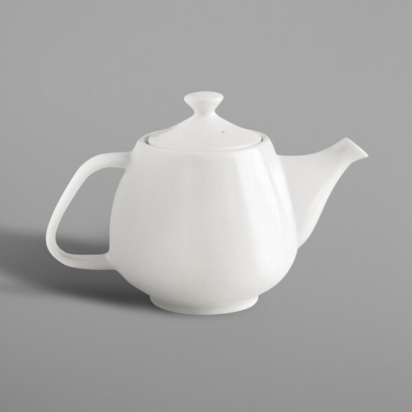 A close-up of a RAK Porcelain ivory teapot with a lid.