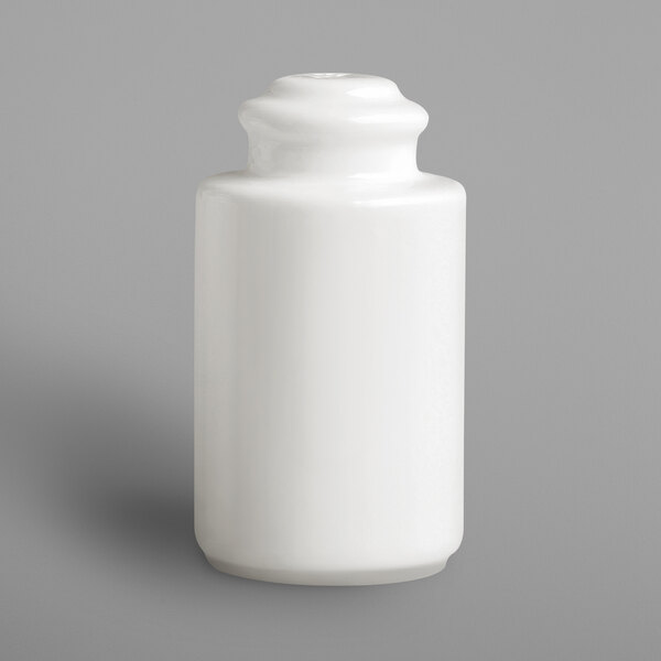 A white porcelain pepper shaker with a black cap.