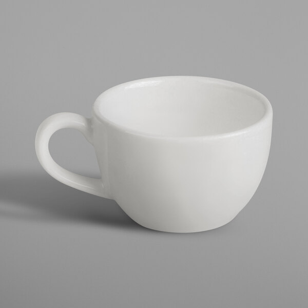 A RAK Porcelain ivory cup with a handle on a white background.