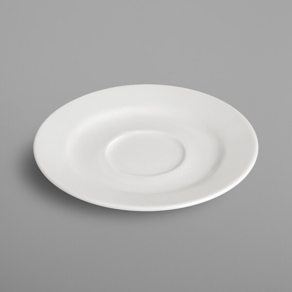 A RAK Porcelain ivory saucer with a circular edge.