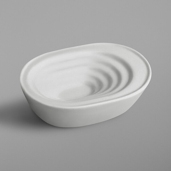 A RAK Porcelain ivory porcelain bowl with a wavy surface.
