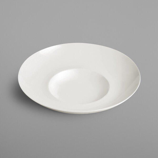 A RAK Porcelain ivory porcelain plate with a curved edge.