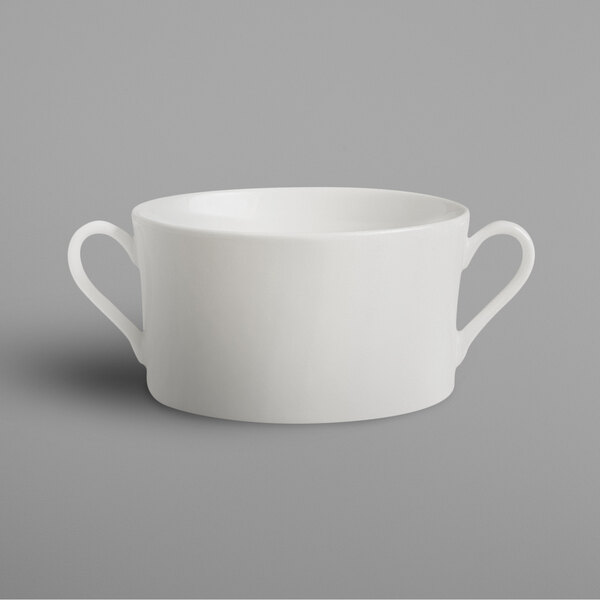 A white curved object with two handles.