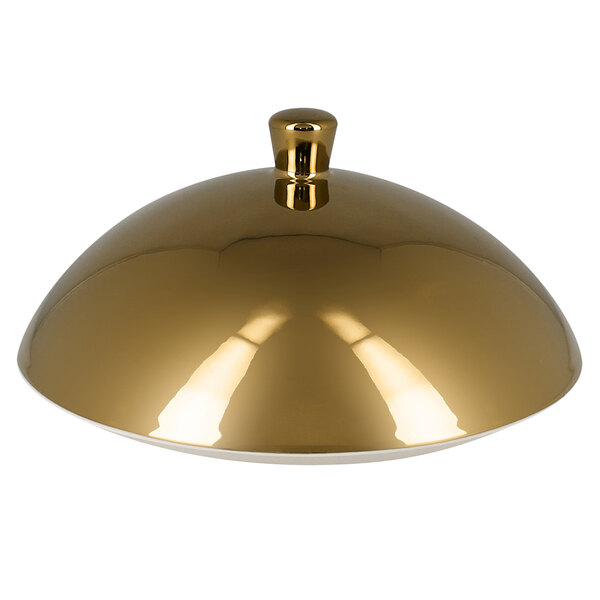 A gold dome shaped RAK Porcelain gourmet plate cover.