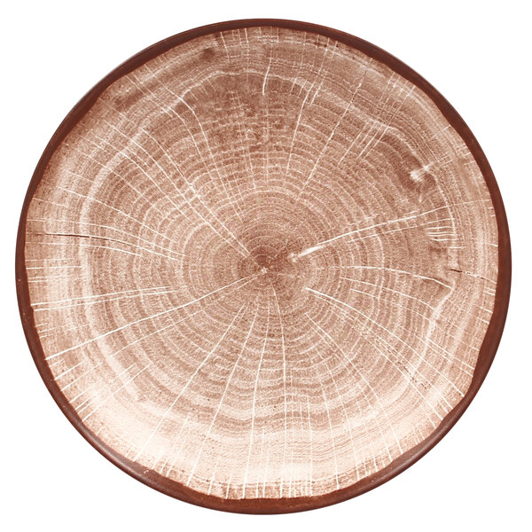 A RAK Porcelain walnut brown porcelain coupe plate with a tree stump pattern.