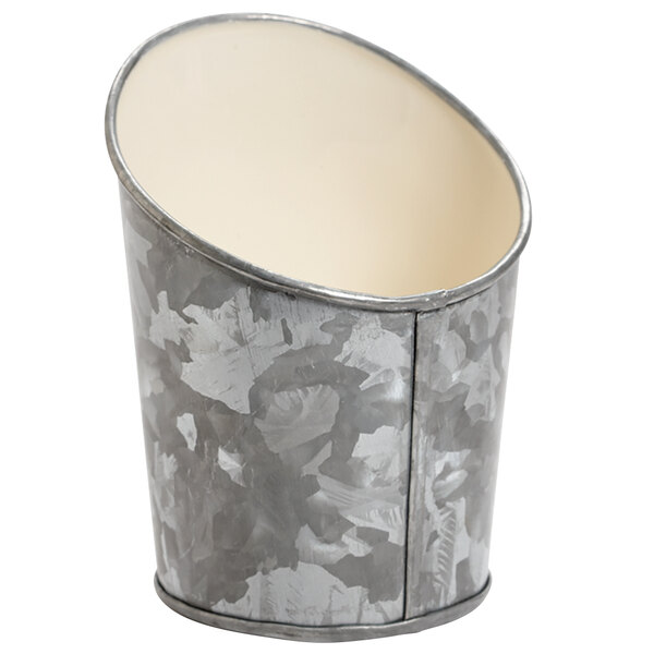 A silver metal container with a white rim.