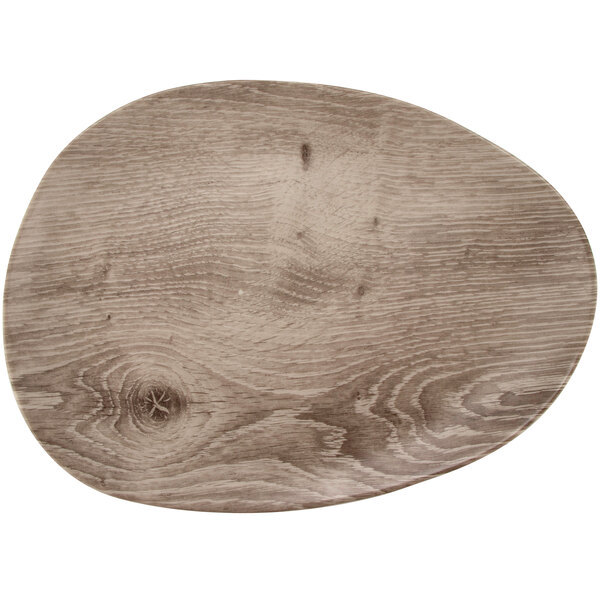 A Madison Avenue faux birch wood serving board with a wood grained surface.