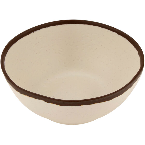 A matte cream melamine bowl with a brown rim.