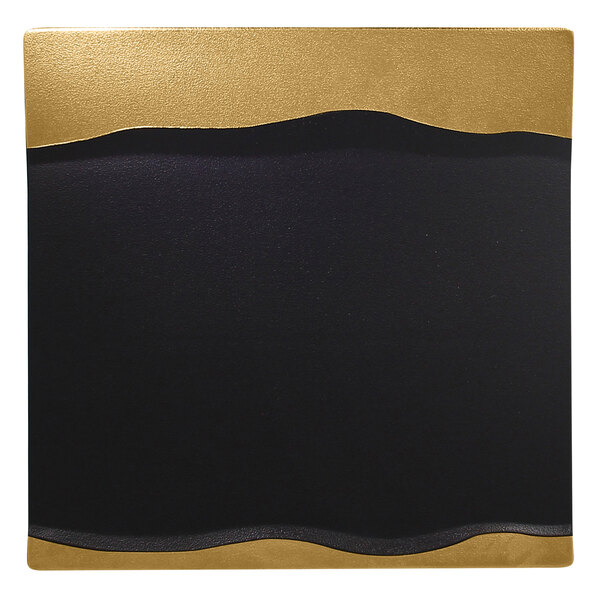 A black and gold square RAK Porcelain platter with a wave design.