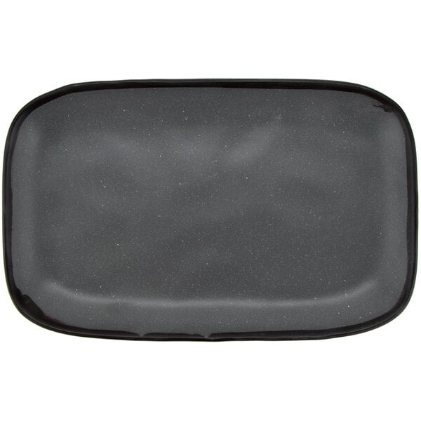 A matte speckled gray rectangular platter with a small rim.