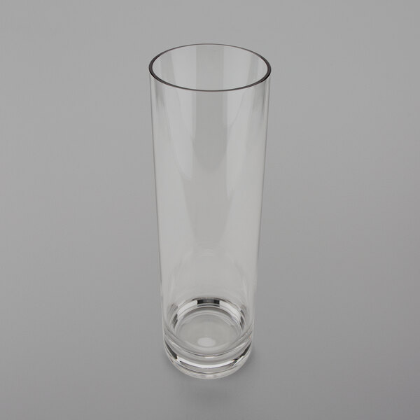 A clear polycarbonate accent vase on a white surface.