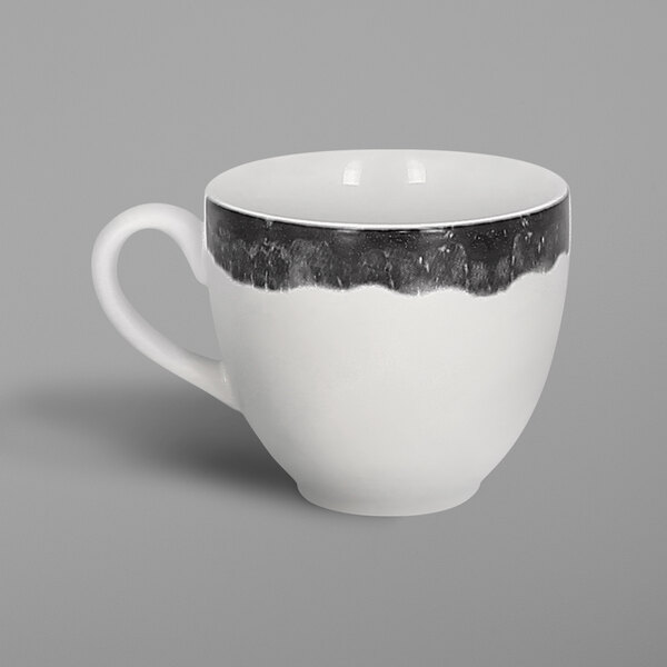 A white porcelain coffee cup with black beech accents.