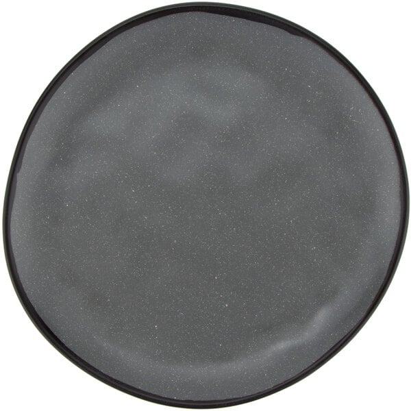 A grey melamine dinner plate with speckled edges.