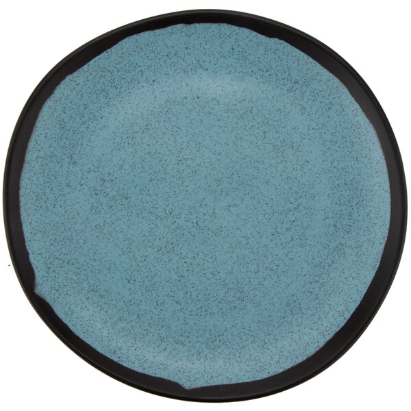 A close-up of a GET Matte Speckled Grayish Blue Melamine Bread Plate with a blue speckled surface.