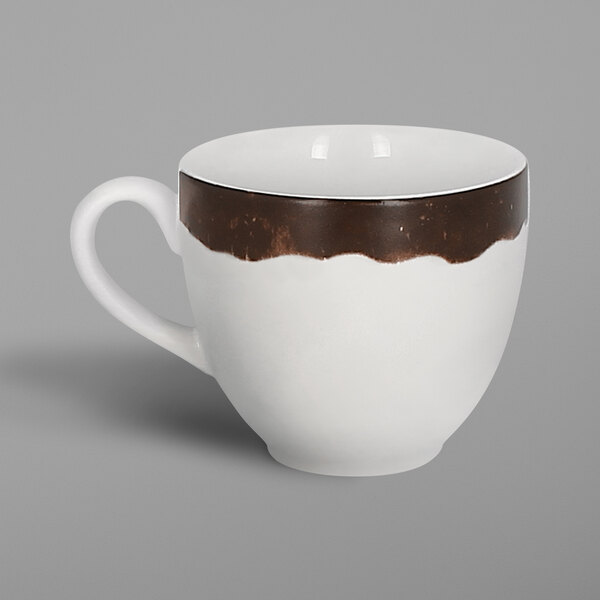 A white porcelain coffee cup with a brown and oak brown rim and handle.