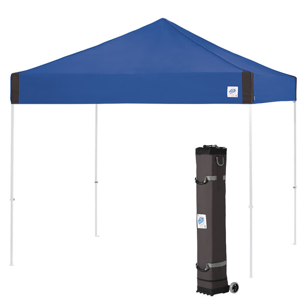 A blue E-Z Up canopy with a black bag on the side with a white sticker.