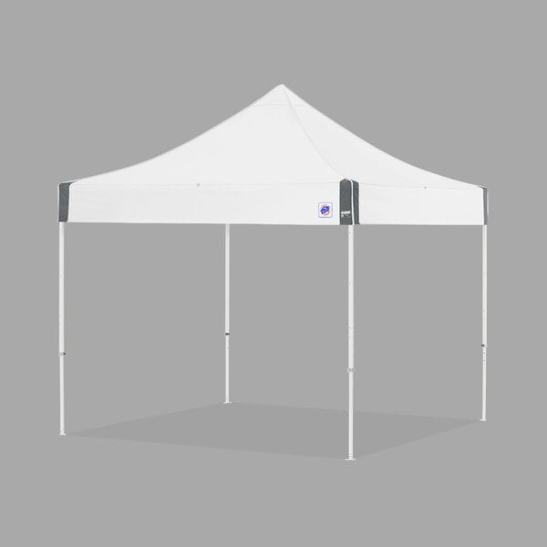 A white E-Z Up canopy tent with white poles.
